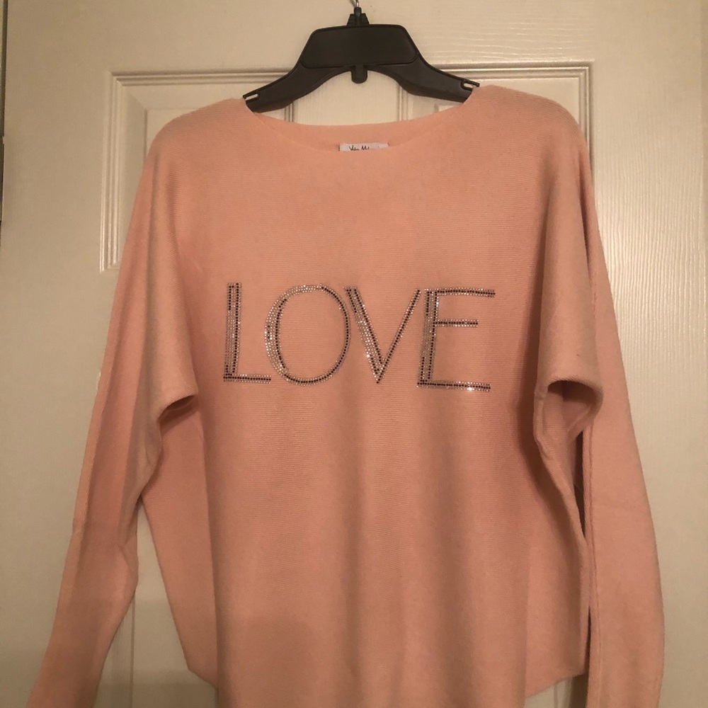 This is a very soft nice sweater, never worn still will tags. The size is a Med